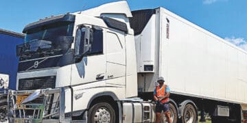 Raghav Patel with one of Auscold Transport’s Carrier-powered trailers. Image: AusCold Transport.