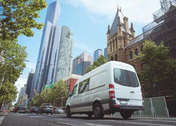 A white delivery van on a city street. Image: jamesteohart/stock.adobe.com.